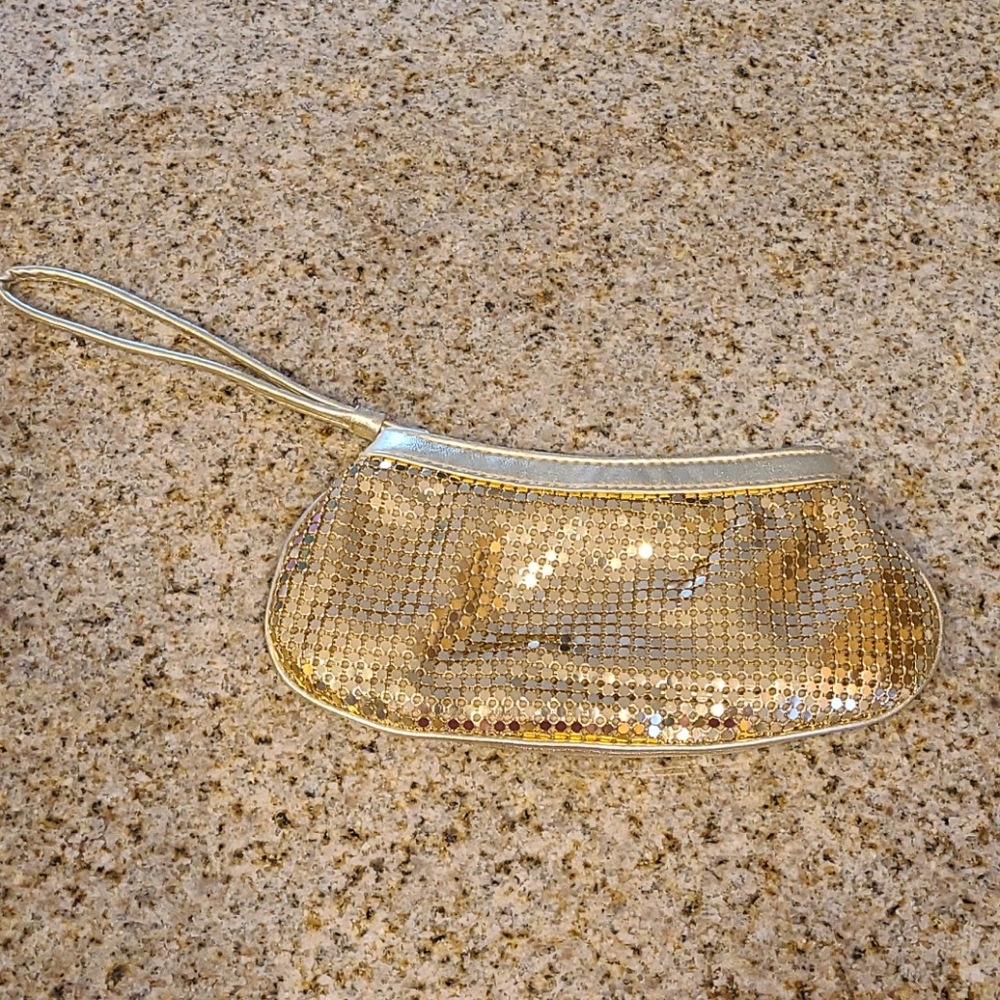Gold clutch. Evening bag. Wristlet